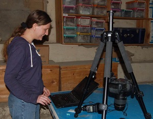 RTI specialist Sarah Chapman at work in the lab photographing the Horus amulet seen below